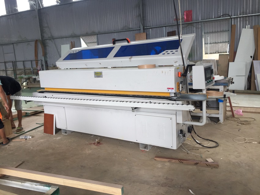 máy dán cạnh cầm tay